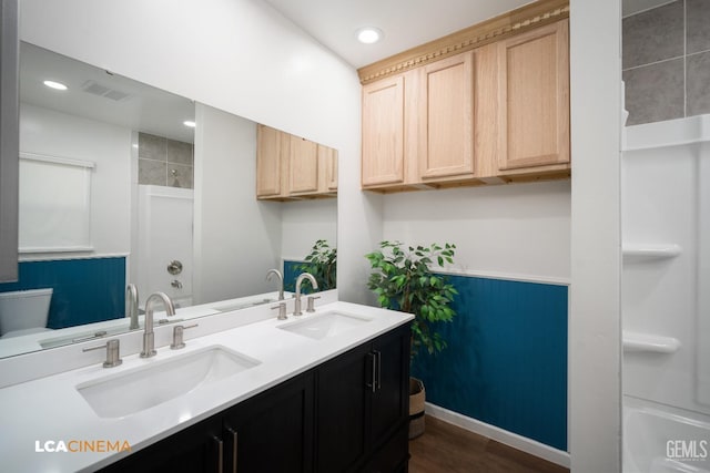 200 Minner Ave, Bakersfield, CA 93308 - bathroom with a sink, visible vents, and wood finished floors