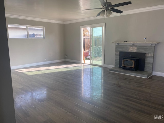 unfurnished living room featuring a wood stove, ceiling fan, dark hardwood / wood-style floors, and ornamental molding