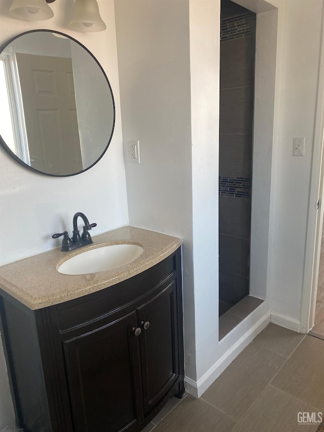 bathroom with tile patterned flooring and vanity