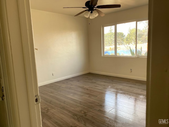 empty room with wood-type flooring and ceiling fan