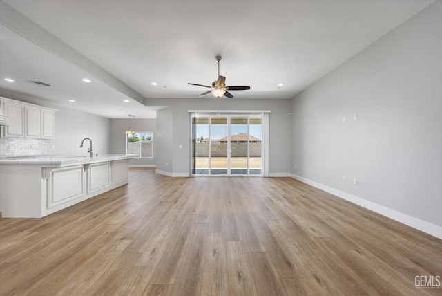 205 Goertzen Ave, Shafter, CA 93263 - unfurnished living room with light wood-type flooring, recessed lighting, and ceiling fan