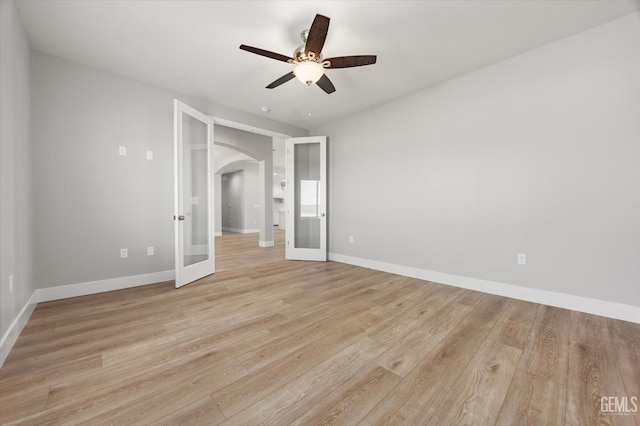 205 Goertzen Ave, Shafter, CA 93263 - unfurnished bedroom featuring arched walkways, light wood-type flooring, and a ceiling fan