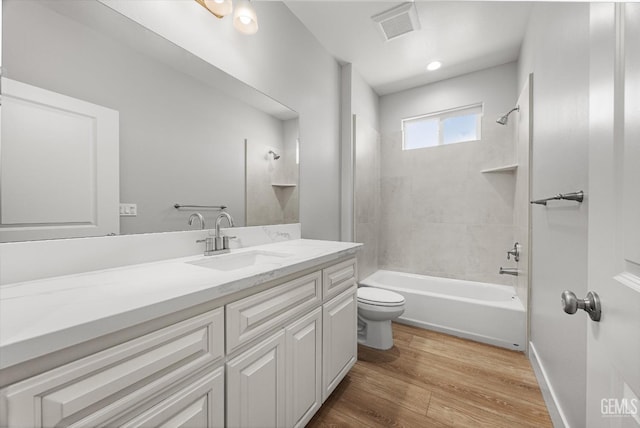 205 Goertzen Ave, Shafter, CA 93263 - bathroom featuring vanity,  shower combination, and wood finished floors