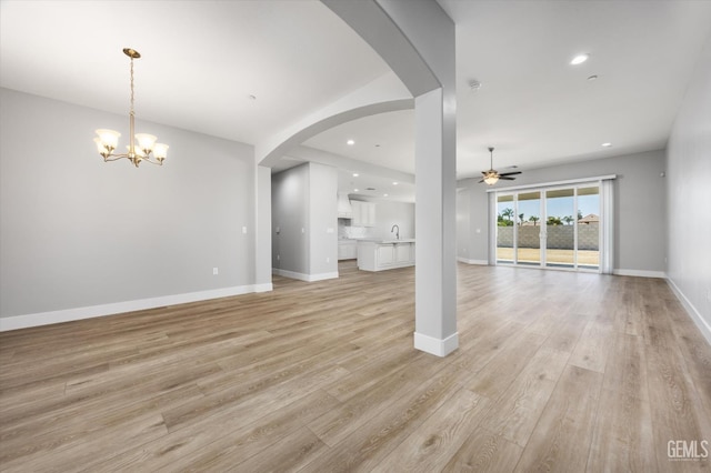 205 Goertzen Ave, Shafter, CA 93263 - unfurnished living room with ceiling fan, light wood-type flooring, a chandelier, and recessed lighting
