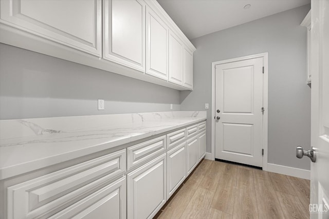 205 Goertzen Ave, Shafter, CA 93263 - laundry room featuring light wood-style floors and baseboards