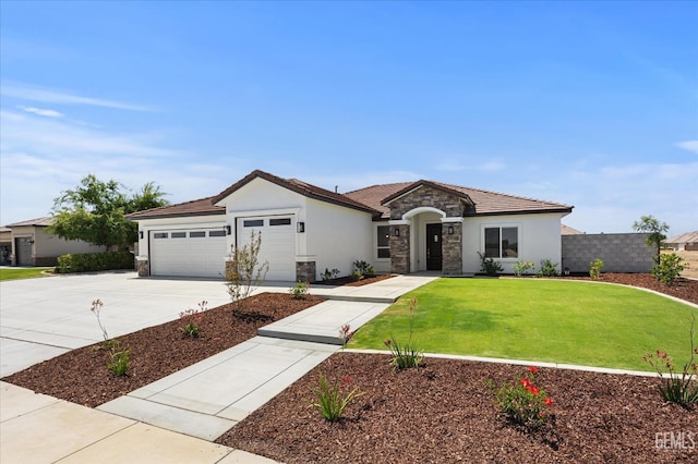 205 Goertzen Ave, Shafter, CA 93263 - view of front of home with stone siding, driveway, an attached garage, stucco siding, and a tiled roof