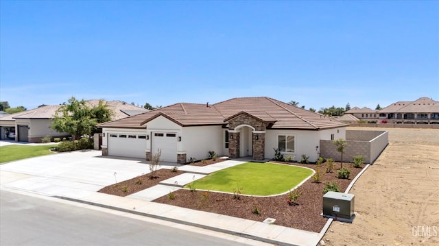 205 Goertzen Ave, Shafter, CA 93263 - view of front facade with stone siding, an attached garage, stucco siding, and driveway