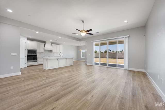 205 Goertzen Ave, Shafter, CA 93263 - unfurnished living room with a ceiling fan, light wood-type flooring, and recessed lighting