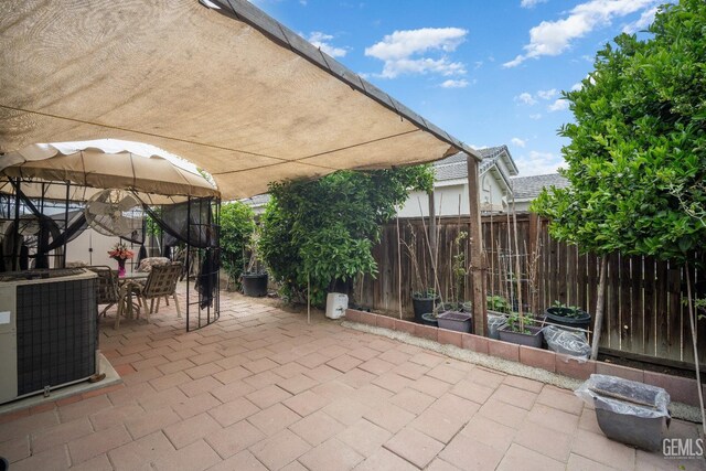 1701 San Jose Ave, Wasco, CA 93280 - view of patio with a gazebo, outdoor dining space, and central AC