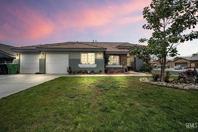 1701 San Jose Ave, Wasco, CA 93280 - ranch-style home featuring stucco siding, a tile roof, driveway, a garage, and a front lawn