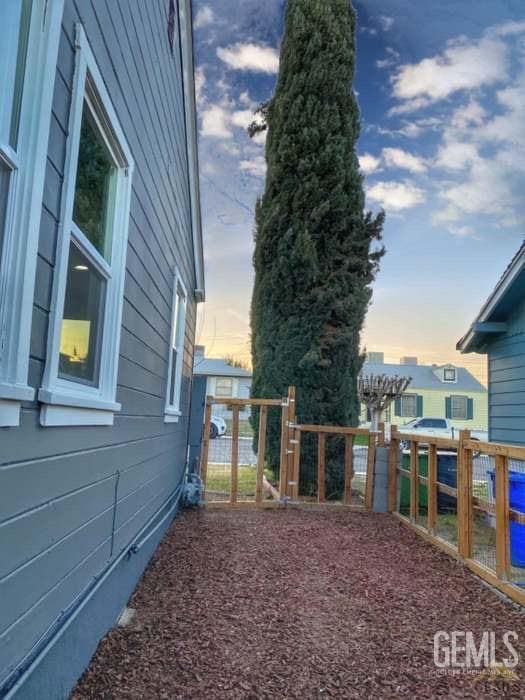 132 Franklin Ave, Taft, CA 93268 - yard at dusk with fence