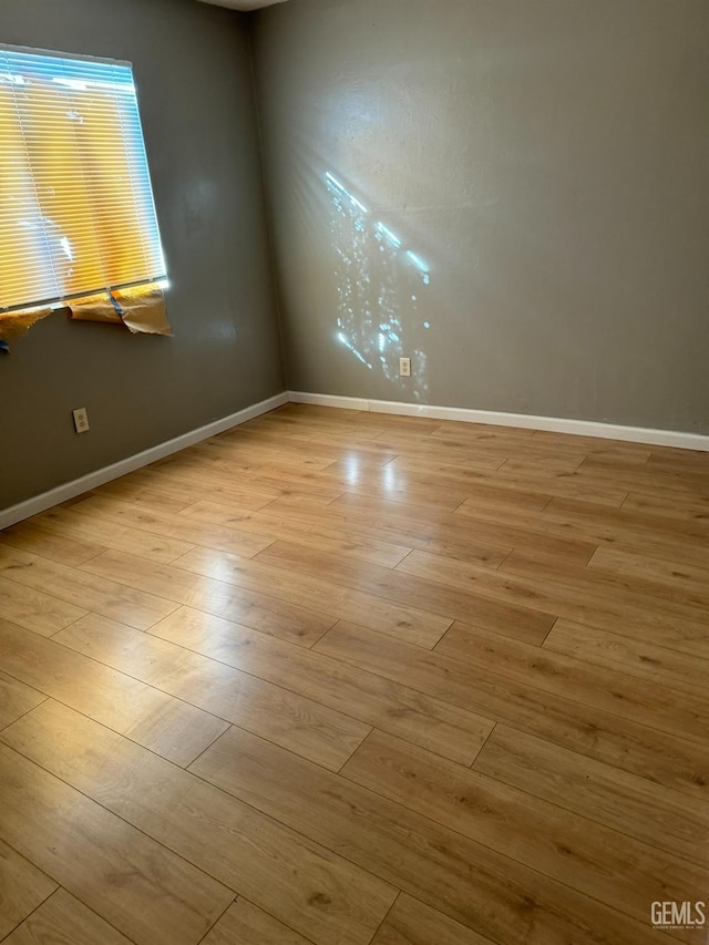 spare room featuring light hardwood / wood-style floors