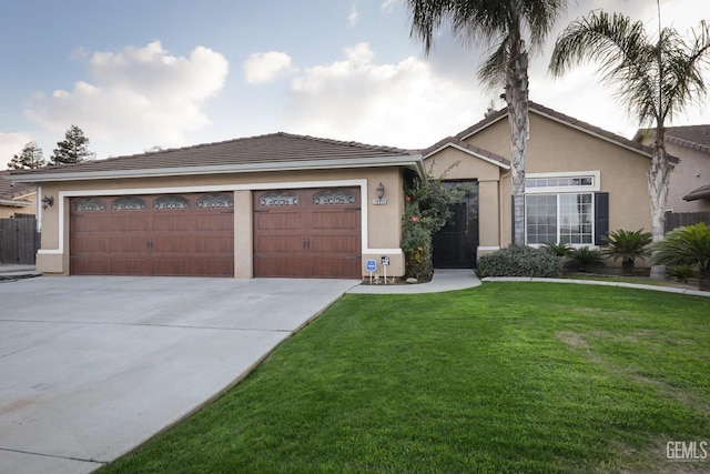 ranch-style home featuring a garage and a front lawn