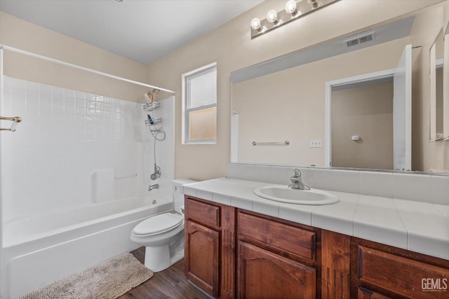 5502 Veneto St, Bakersfield, CA 93308 - full bath featuring wood finished floors, toilet, vanity, and shower / bath combination