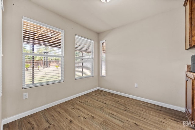 5502 Veneto St, Bakersfield, CA 93308 - spare room featuring wood finished floors, baseboards, and healthy amount of natural light