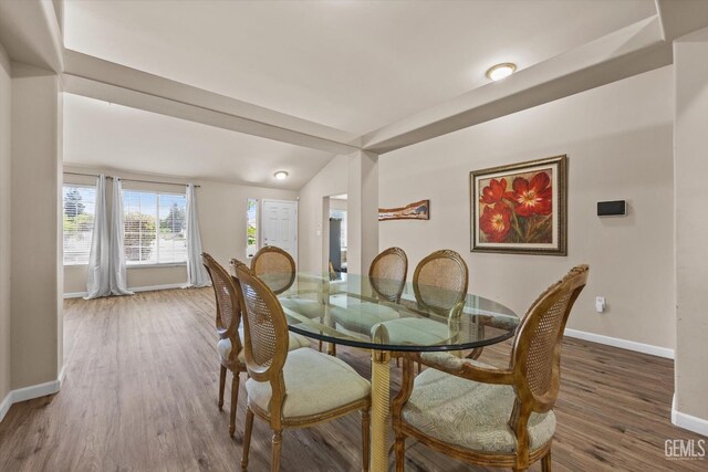 5502 Veneto St, Bakersfield, CA 93308 - dining space with baseboards, wood finished floors, and vaulted ceiling