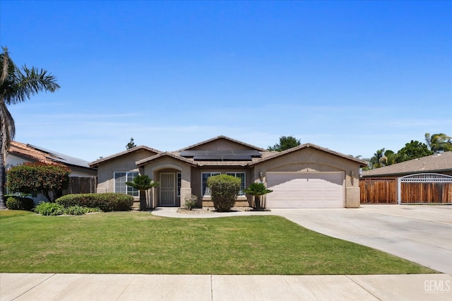 5502 Veneto St, Bakersfield, CA 93308 - ranch-style home with concrete driveway, an attached garage, stucco siding, and solar panels
