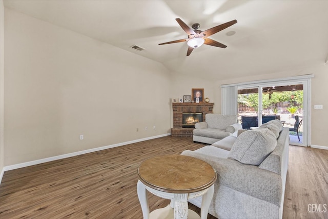 5502 Veneto St, Bakersfield, CA 93308 - living area with ceiling fan, baseboards, wood finished floors, a brick fireplace, and lofted ceiling