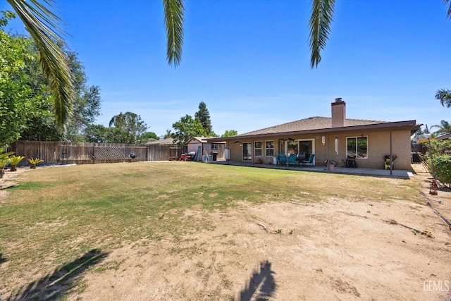 5502 Veneto St, Bakersfield, CA 93308 - rear view of house featuring a patio, a chimney, and stucco siding