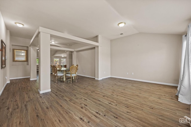 5502 Veneto St, Bakersfield, CA 93308 - living room with vaulted ceiling, wood finished floors, and baseboards