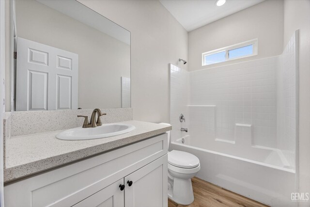 135 L St, Bakersfield, CA 93304 - bathroom with vanity, shower / bath combination, and wood finished floors