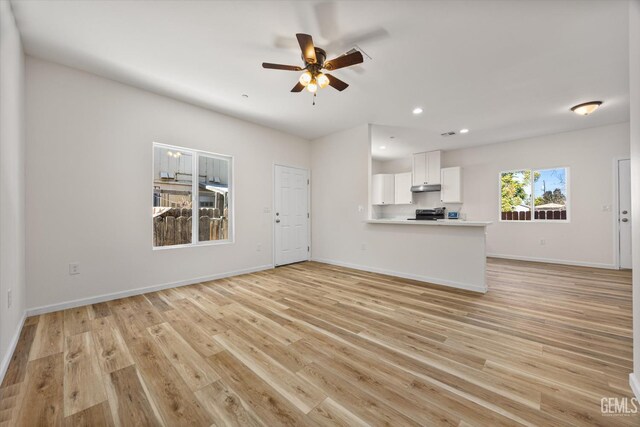 135 L St, Bakersfield, CA 93304 - unfurnished living room with a ceiling fan, light wood-type flooring, and recessed lighting