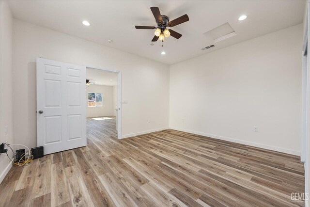 135 L St, Bakersfield, CA 93304 - spare room with attic access, light wood-type flooring, ceiling fan, and recessed lighting
