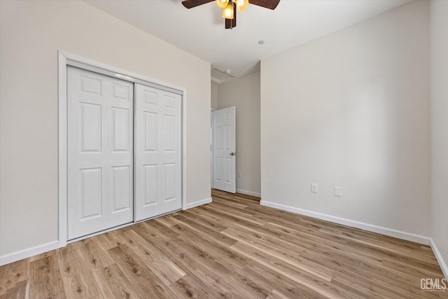 135 L St, Bakersfield, CA 93304 - unfurnished bedroom with light wood-style floors, a closet, and a ceiling fan