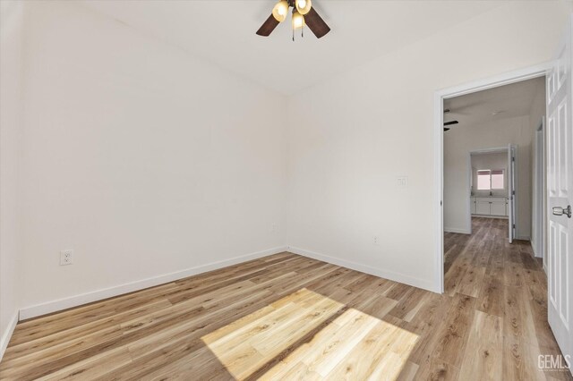 135 L St, Bakersfield, CA 93304 - empty room featuring a ceiling fan and light wood finished floors