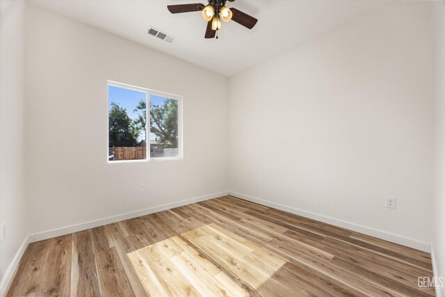 135 L St, Bakersfield, CA 93304 - empty room featuring ceiling fan and wood finished floors