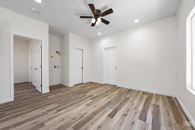 135 L St, Bakersfield, CA 93304 - unfurnished bedroom with light wood finished floors, recessed lighting, and a ceiling fan
