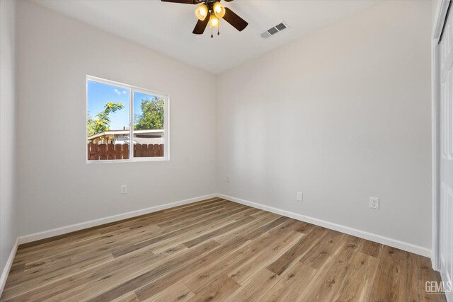 135 L St, Bakersfield, CA 93304 - unfurnished room featuring light wood finished floors and ceiling fan