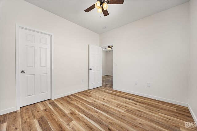 135 L St, Bakersfield, CA 93304 - unfurnished bedroom featuring light wood finished floors and ceiling fan