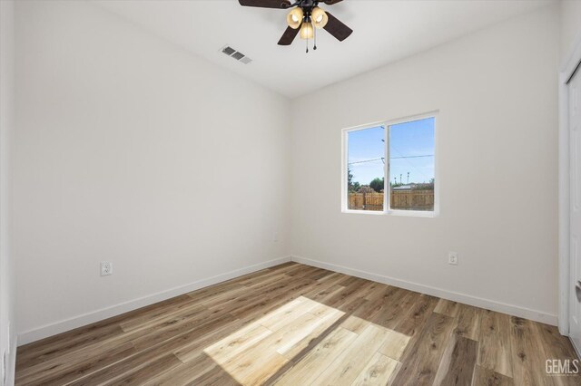 135 L St, Bakersfield, CA 93304 - empty room featuring ceiling fan and wood finished floors