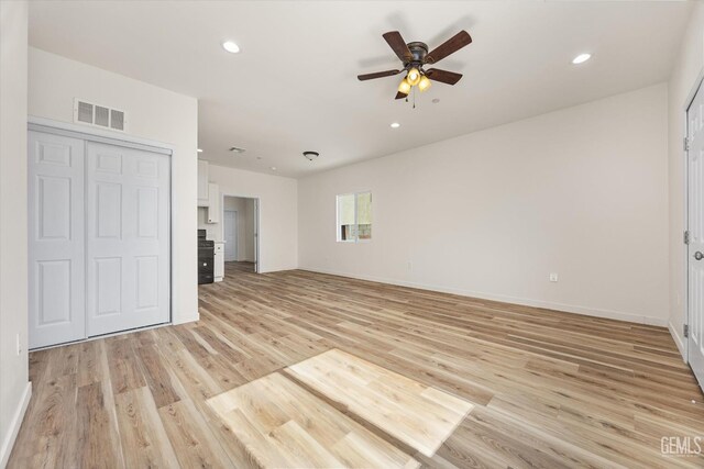 135 L St, Bakersfield, CA 93304 - unfurnished bedroom featuring light wood-style floors, recessed lighting, a closet, and ceiling fan