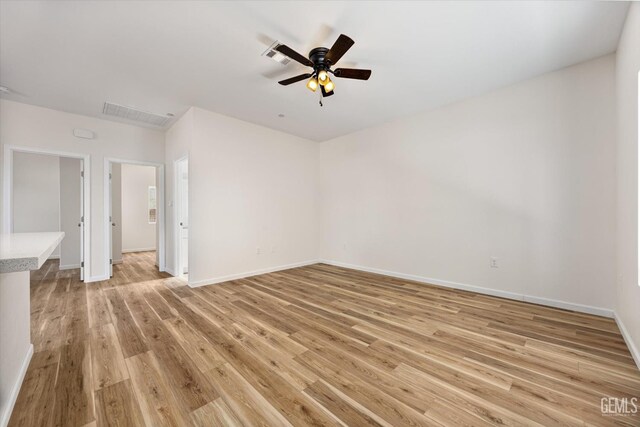 135 L St, Bakersfield, CA 93304 - unfurnished room featuring light wood-style flooring and ceiling fan
