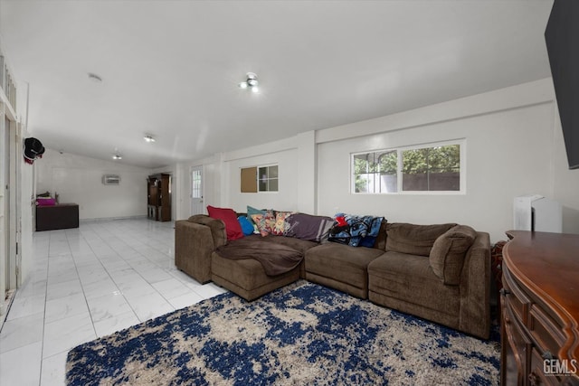 living room featuring a wealth of natural light, marble finish floor, and lofted ceiling