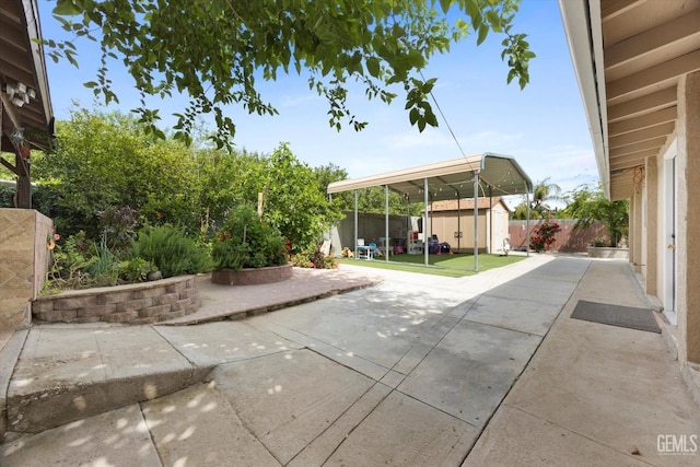 view of patio with a storage shed, an outdoor structure, and a fenced backyard