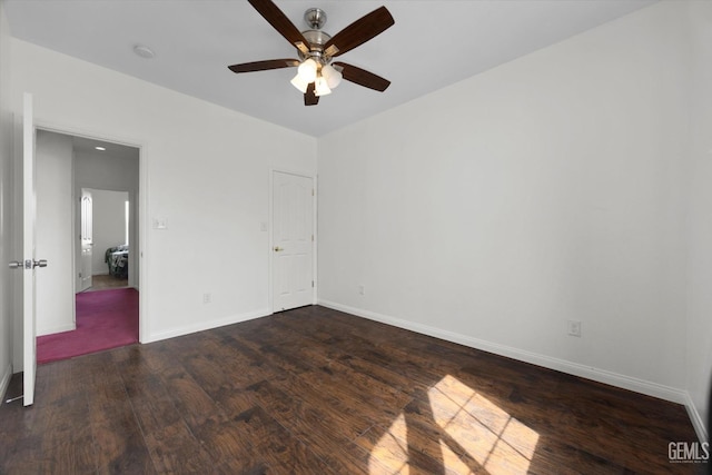 unfurnished bedroom with a ceiling fan, baseboards, and wood finished floors
