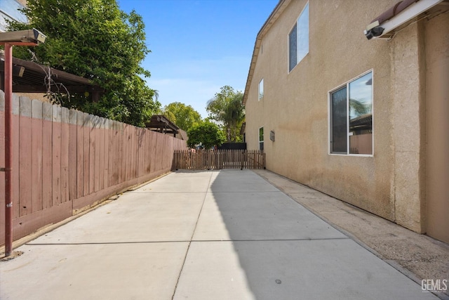 view of patio / terrace featuring fence