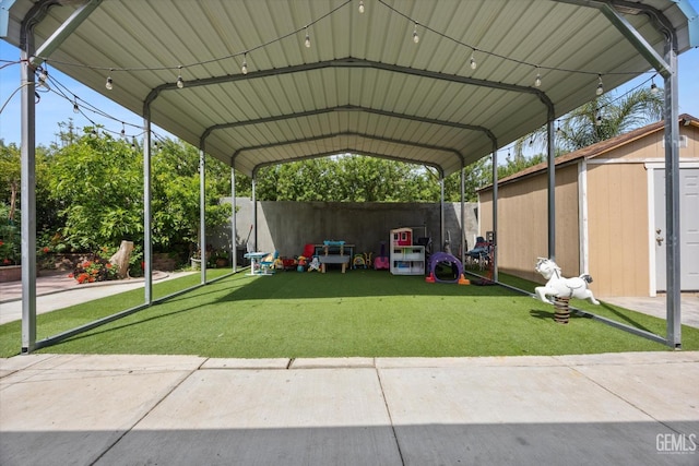 view of parking / parking lot featuring a shed, fence, and a carport