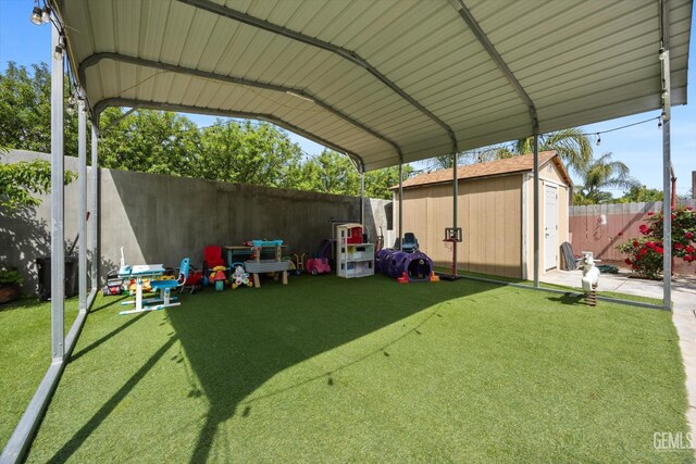 exterior space with a fenced backyard, a shed, and a detached carport