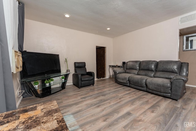 5435 Rd 37, Alpaugh, CA 93201 - living area featuring wood finished floors and recessed lighting
