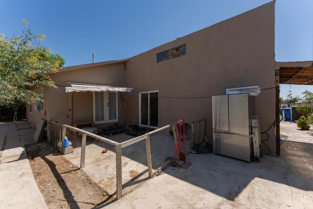 5435 Rd 37, Alpaugh, CA 93201 - rear view of house with french doors, stucco siding, and a patio