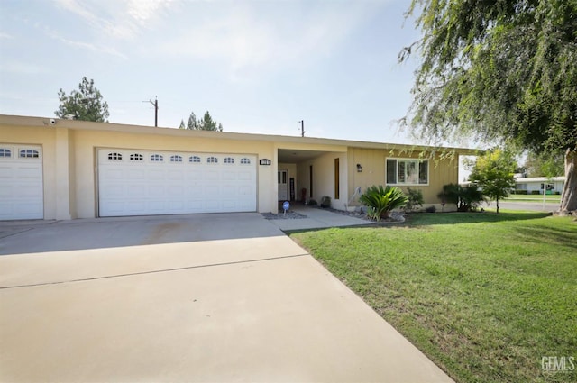 ranch-style house featuring a garage and a front yard