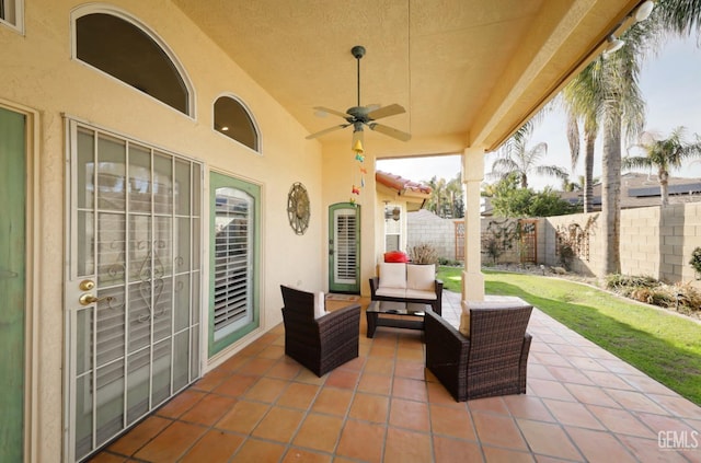 view of patio / terrace with ceiling fan, outdoor lounge area, and fence