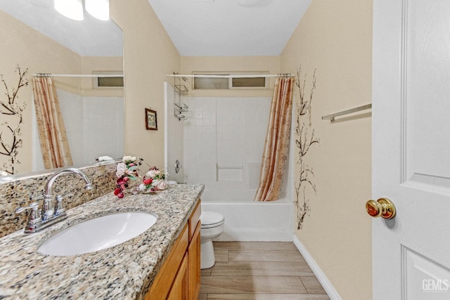 bathroom with vanity, shower / bathtub combination with curtain, wood finished floors, and toilet