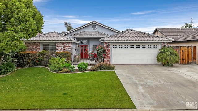 single story home featuring a tiled roof, driveway, a front yard, a garage, and fence
