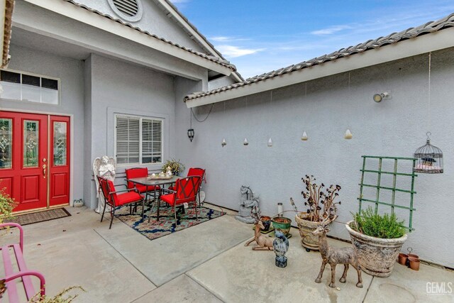 view of patio featuring outdoor dining area