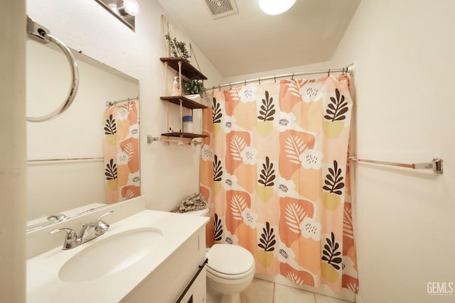 bathroom with tile patterned floors, toilet, and vanity